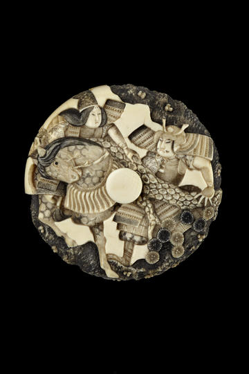 Carved Japanese toggle portraying a women, a man and a horse